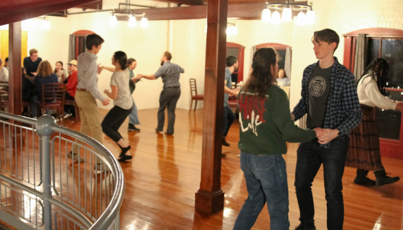 Students dance in the upper floor of Tracy