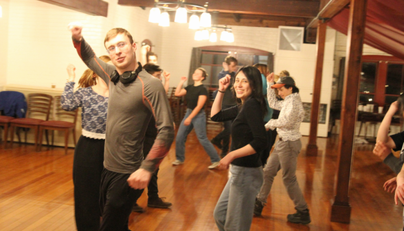 Students do a group dance