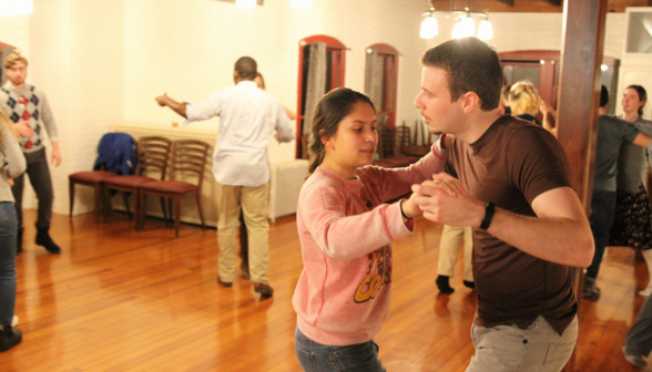 A student pair dances in waltz form