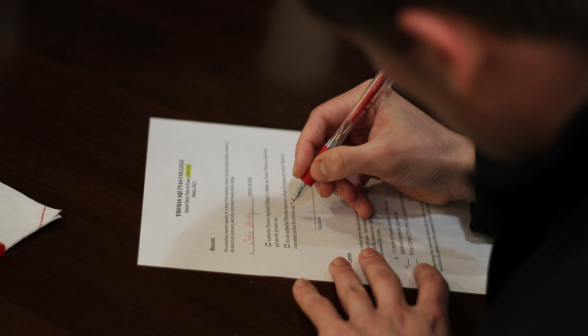 A student completes the associated paperwork