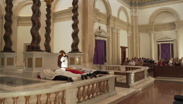 The priests prostrate themselves at the altar
