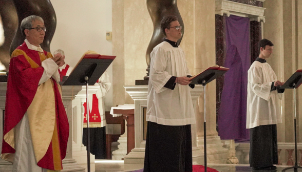 Fr. Chung reads the reading with two lectors