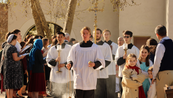 The altar servers process