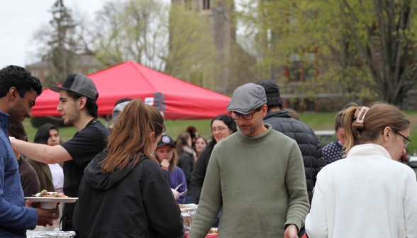 Kitchen workers serve students