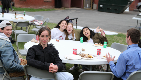 Students at one of the outdoor tables