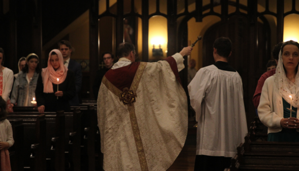Fr. Markey asperges the congregation