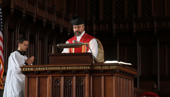 Fr. Viego at the pulpit, wearing his biretta