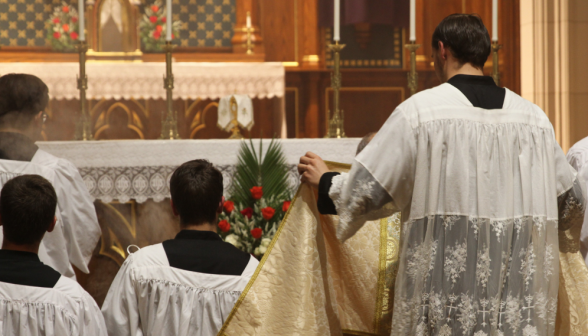 The server covers Fr. Viego with the humeral veil