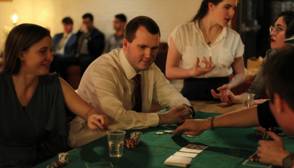 Students play Texas Hold-Em at the poker table