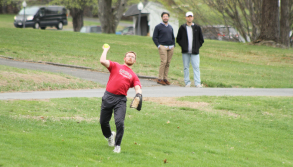 A tutor throws the ball