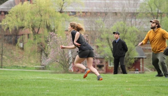 A student speeds around the bases