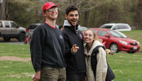 Three pose for a photo