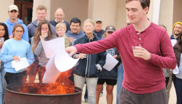 A student burns their draft