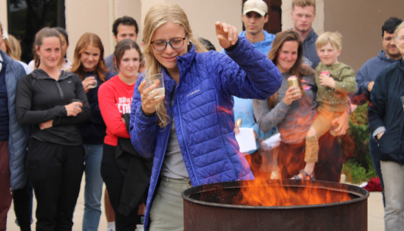 A student burns their draft