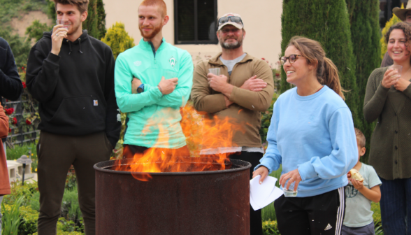 A student burns their draft