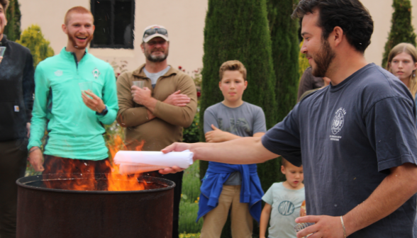 A student burns their draft