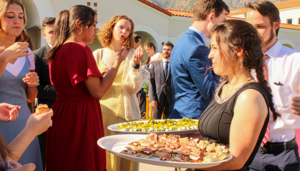 Servers carry around food-trays