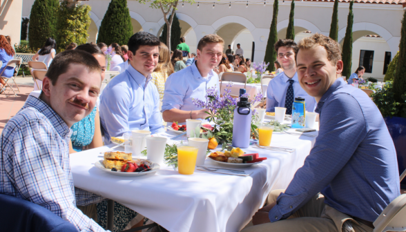 Six pose at a table