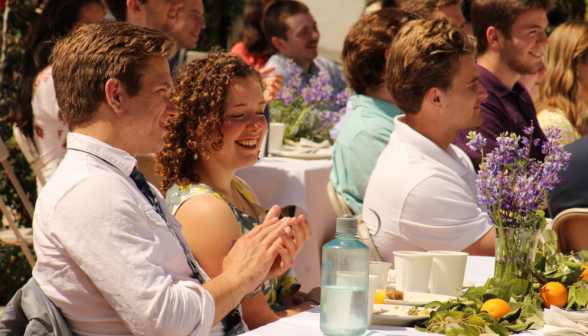 Students listen to the toast