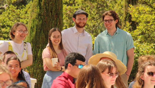 Students listen to the toast