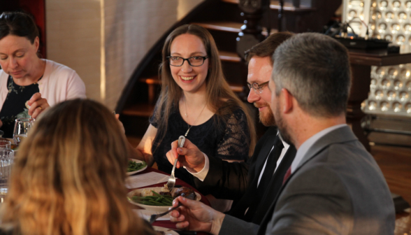 Tutors and their spouses at one of the tables