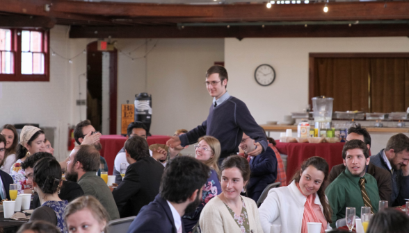 A student gets up to give a toast