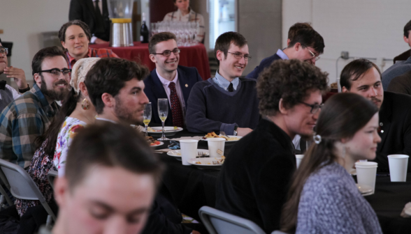 Students listen to a toast