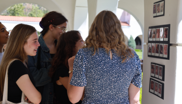 Students at art show on academic quadrangle