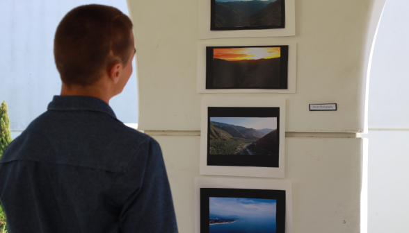 Students at art show on academic quadrangle