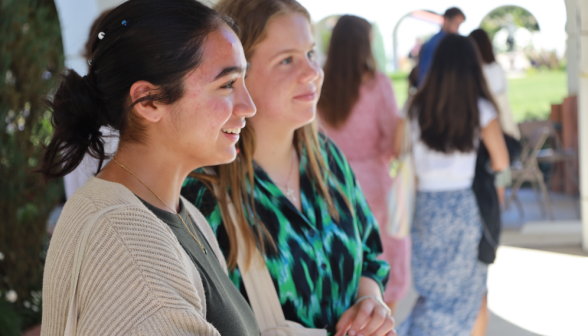 Students at art show on academic quadrangle