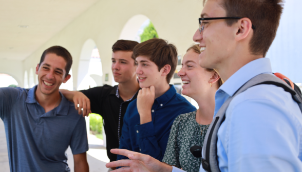 Students at art show on academic quadrangle