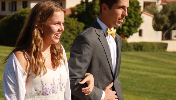 Gentlemen escort the ladies to the banquet