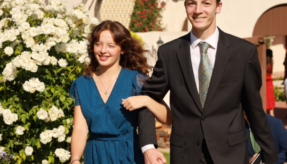 Gentlemen escort the ladies to the banquet