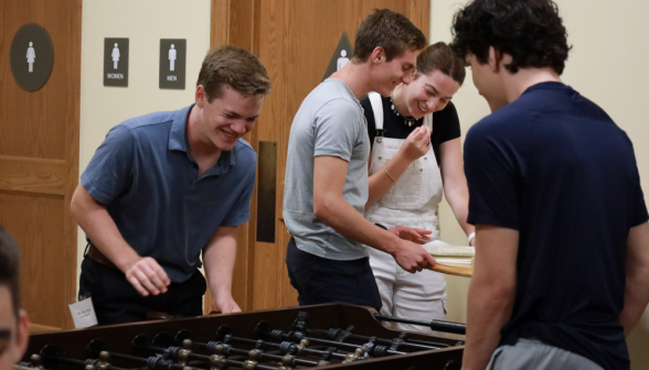 Students play foosball