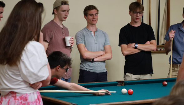 Students play pool