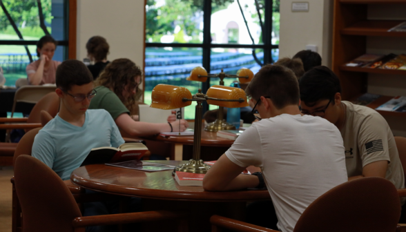 Students study at an east wing table