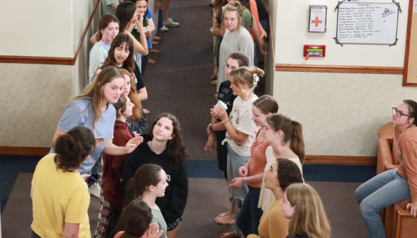 Students pair up in a hallway