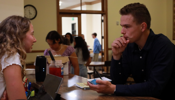 A student at the coffee shop counter