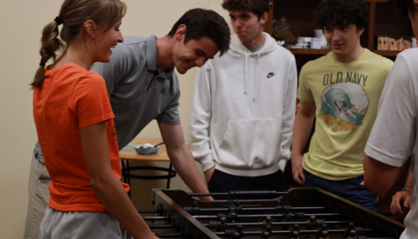 Students play foosball