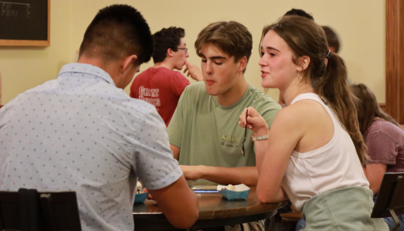 Students eat sundaes and chat