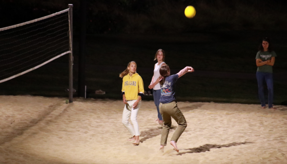 Students play volleyball