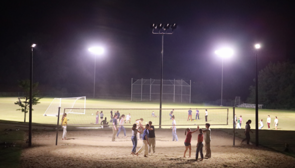 Students play volleyball