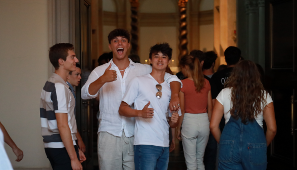 Several pose outside the open Chapel doors