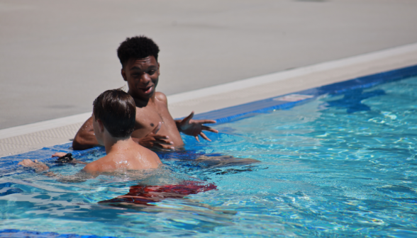 Two chat in the pool