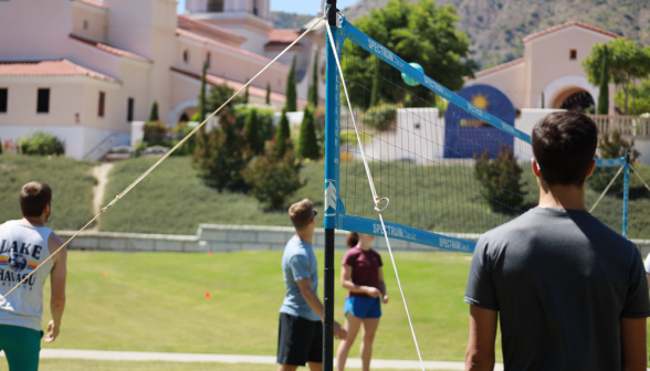 Students play volleyball