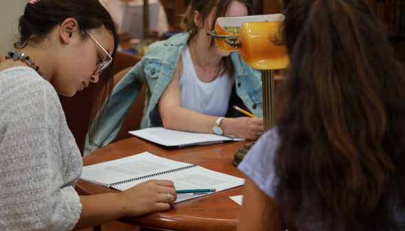 Students study together at a table