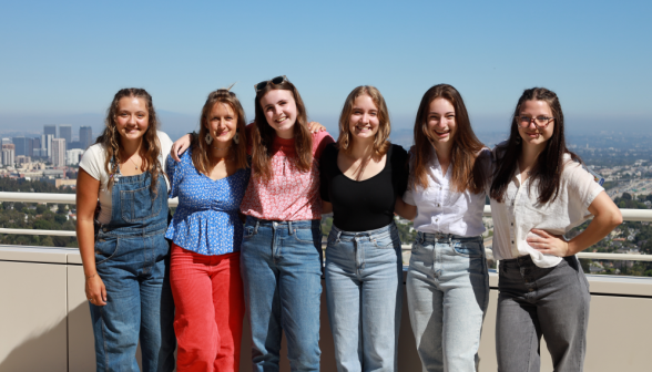 Six pose together afront the Getty vista