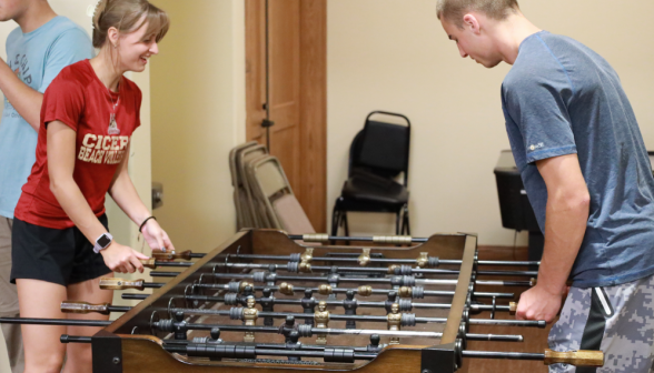 Two play foosball