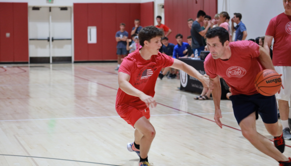 Two compete for possession of the ball