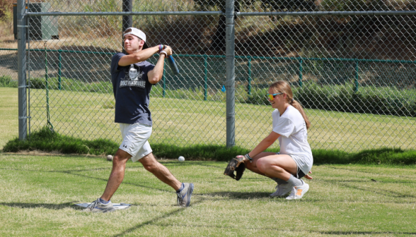 Students play baseball